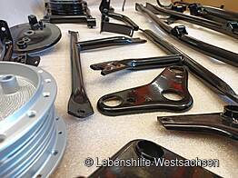 Behindertenwerkstatt Reinsdorf - Pulverbeschichtung von Rahmenteilen eines Mopeds